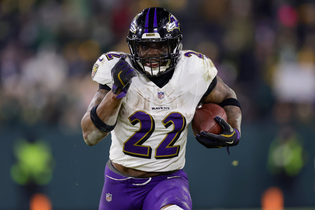 FILE - Baltimore Ravens running back Derrick Henry (22) rushes during an NFL football game between the Green Bay Packers and Baltimore Ravens Saturday, Dec. 27, 2025, in Green Bay, Wis. (AP Photo/Matt Ludtke, File)