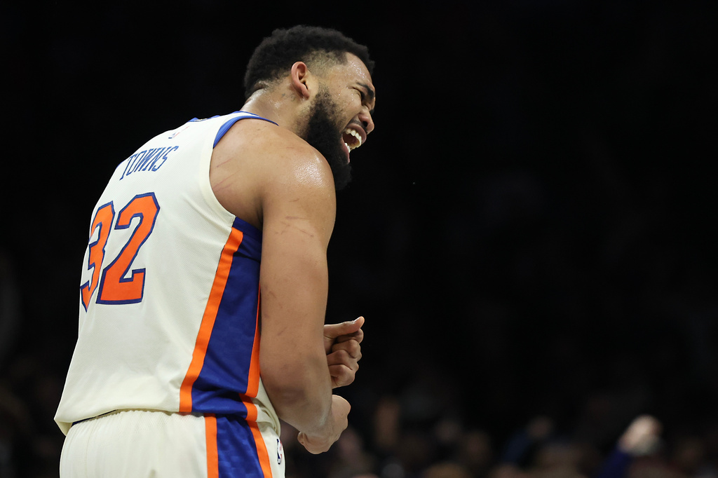 New York Knicks center Karl-Anthony Towns (32) reacts during the second half of an NBA basketball game against the Brooklyn Nets, Friday, March 20, 2026, in New York. (AP Photo/Heather Khalifa)
