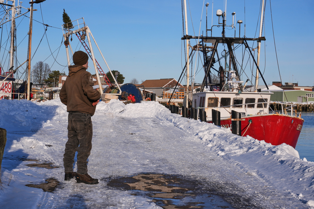 Gryphon Orfanos, who in the past worked on the fishing vessel "Lily Jean", stands on the pier of the homeport of the fishing boat that went missing with seven onboard, Monday, Feb. 2, 2026, in Gloucester, Mass. (AP Photo/Charles Krupa)