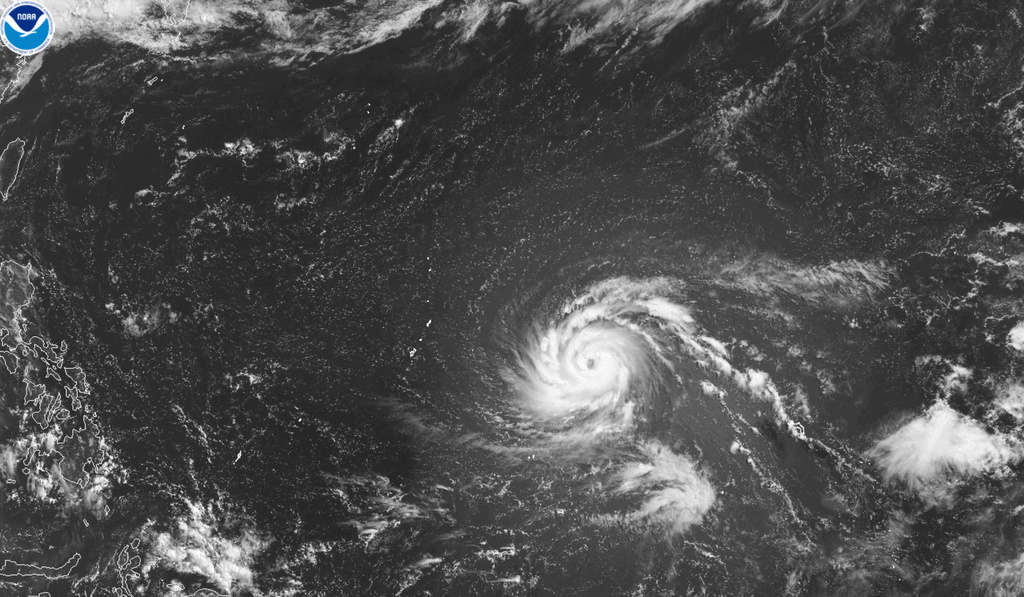 This satellite image from the National Oceanic and Atmospheric Administration shows Typhoon Bavi east of the U.S. Pacific island territory of Guam on Friday, July 3, 2026. (NOAA via AP)