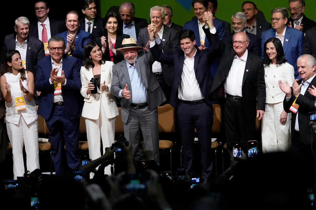 Brazilian President Luiz Inacio Lula da Silva, center left, and Vice President Geraldo Alckmin, center right, stand alongside Brazilian Socialist Party President Joao Campos during the Brazilian Socialist Party convention, where Alckmin was formally nominated as Lula's running mate for the October presidential election, in Brasilia, Brazil, Wednesday, July 29, 2026. (AP Photo/Eraldo Peres)