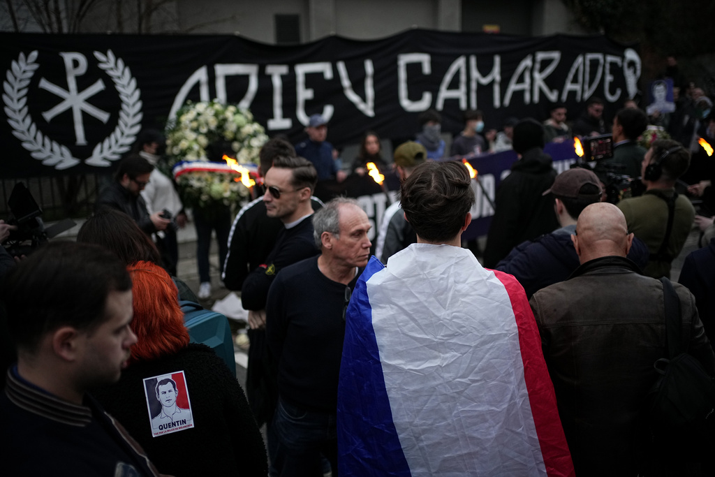 People hold a banner reading 'Goodbye mate' as they take part in a march in Lyon, France, Saturday, Feb. 21, 2026, to pay tribute to Quentin Deranque, a 23-year-old nationalist activist who died from a beating after a clash between far-left and far-right supporters. (AP Photo/Laurent Cipriani)