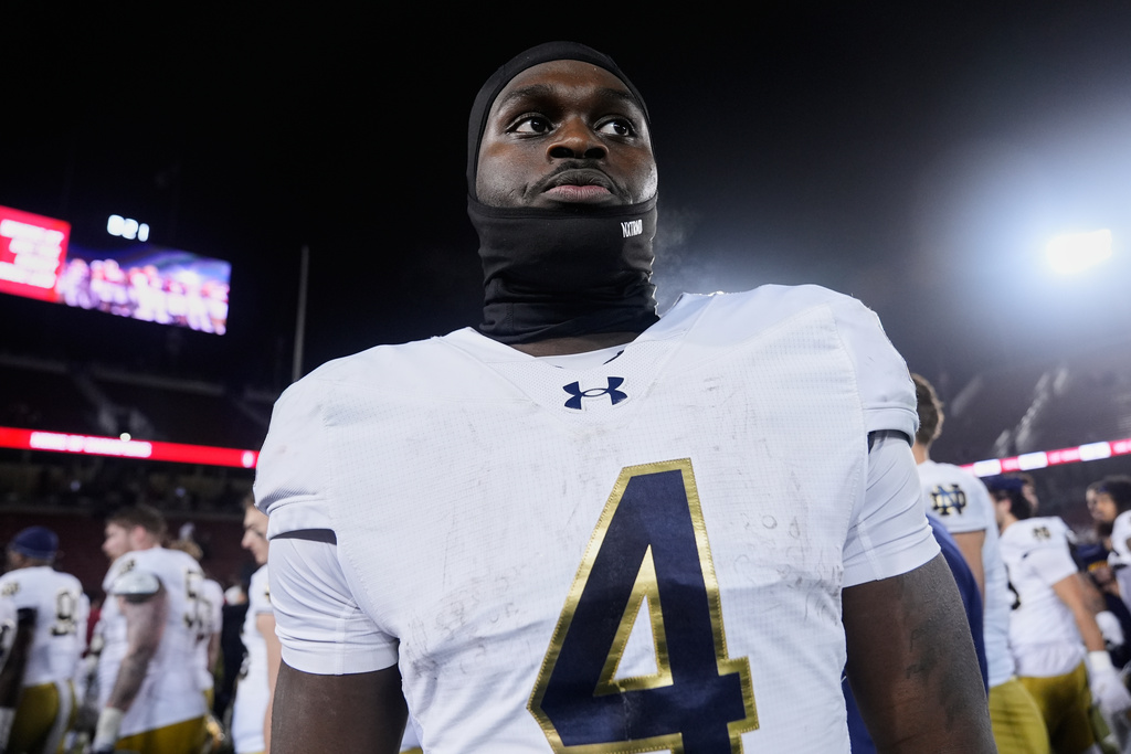 Notre Dame running back Jeremiyah Love (4) walks off the field after the team's victory over the Stanford in an NCAA college football game, Saturday, Nov. 29, 2025, in Stanford, Calif. (AP Photo/Godofredo A. Vásquez)