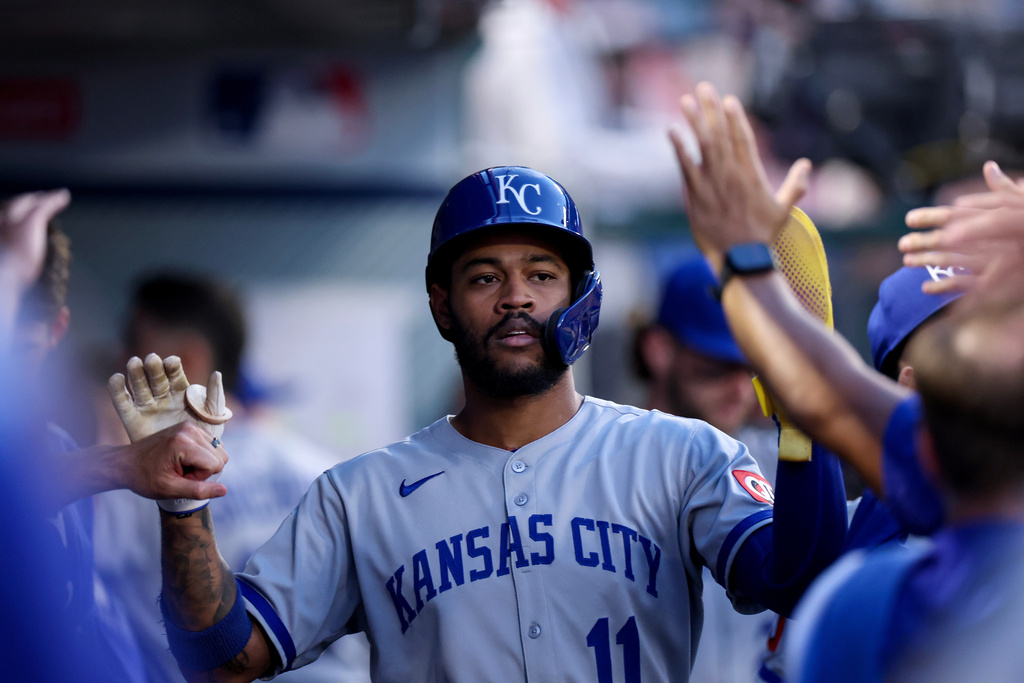 FILE - Kansas City Royals' Maikel Garcia (11) high-fives teammates after scoring a run during the first inning of a baseball game against the Los Angeles Angels Tuesday, Sept. 23, 2025, in Anaheim, Calif. (AP Photo/Eric Thayer, File)