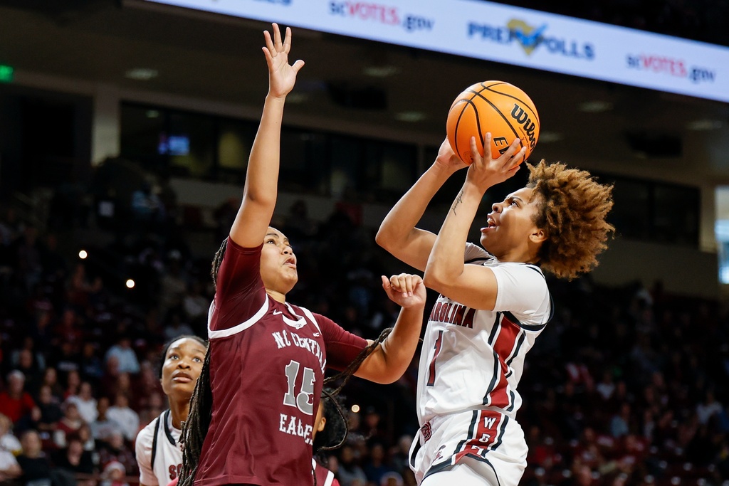 South Carolina guard Maddy McDaniel (1) drives to the basket against North Carolina Central forward Dianna Blake during the first half of an NCAA college basketball game in Columbia, S.C., Sunday, Dec. 7, 2025. (AP Photo/Nell Redmond)