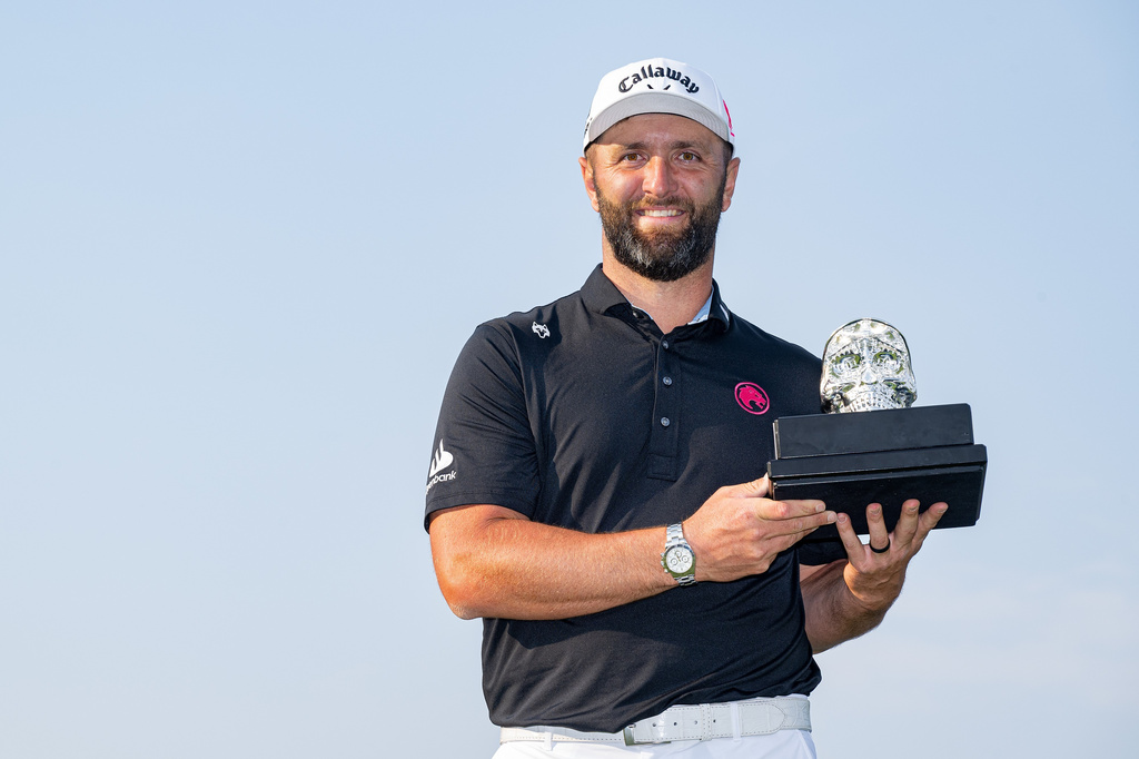 First-place individual champion captain Jon Rahm, of Legion XIII, poses with the trophy after the final round of LIV Golf Mexico City at Club de Golf Chapultepec, Sunday, April 19, 2026, in Naucalpan, Mexico. (Charles Laberge/LIV Golf via AP)