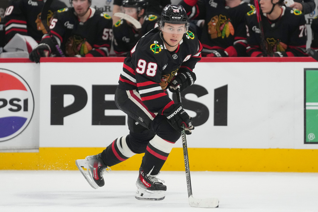 FILE - Chicago Blackhawks center Connor Bedard handles the puck during the second period of an NHL hockey game against the Colorado Avalanche, March 20, 2026, in Chicago. (AP Photo/Erin Hooley, File)