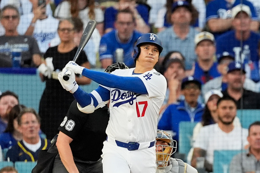FILE - Los Angeles Dodgers' Shohei Ohtani watches his home run during the first inning against the Milwaukee Brewers in Game 4 in baseball's National League Championship Series, Friday, Oct. 17, 2025, in Los Angeles. (AP Photo/Mark J. Terrill, File) FILE - Los Angeles Dodgers' Shohei Ohtani watches his home run during the first inning against the Milwaukee Brewers in Game 4 in baseball's National League Championship Series, Friday, Oct. 17, 2025, in Los Angeles. (AP Photo/Mark J. Terrill, File)