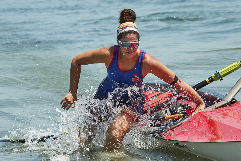 An athlete trains at a beach sprints camp organized by USRowing in Long Beach, Calif., Sunday, Aug. 10, 2025. (AP Photo/Damian Dovarganes)