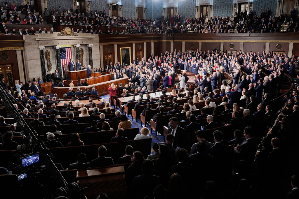 Republican members of Congress stand while Democrats keep their seats during President Donald Trump¥s State of the Union address to a joint session of Congress in the House chamber at the U.S. Capitol in Washington, Tuesday, Feb. 24, 2026. (AP Photo/Alex Brandon)