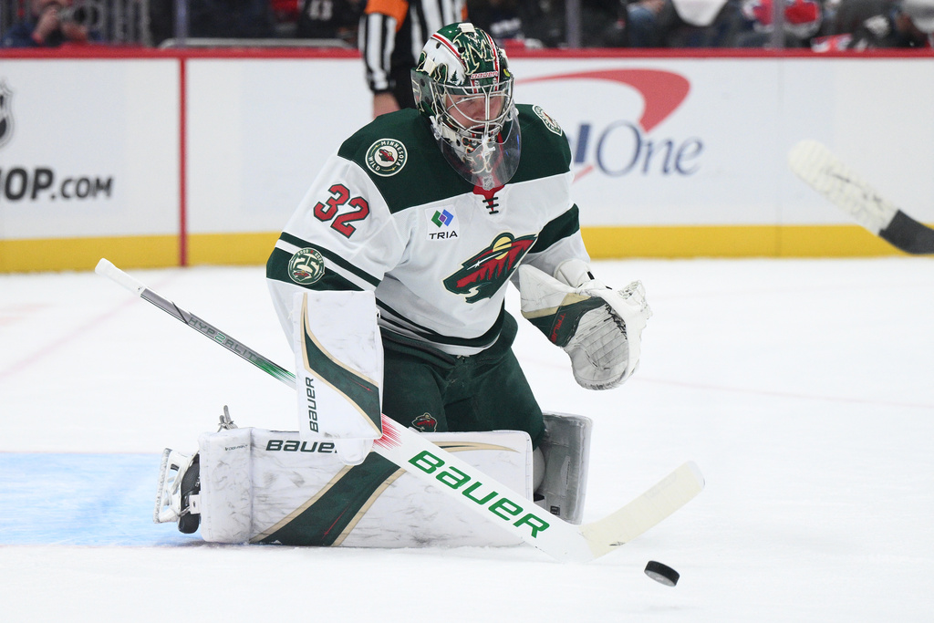 Minnesota Wild goaltender Filip Gustavsson watches the puck during the first period of an NHL hockey game against the Washington Capitals, Friday, Oct. 17, 2025, in Washington. (AP Photo/Nick Wass)
