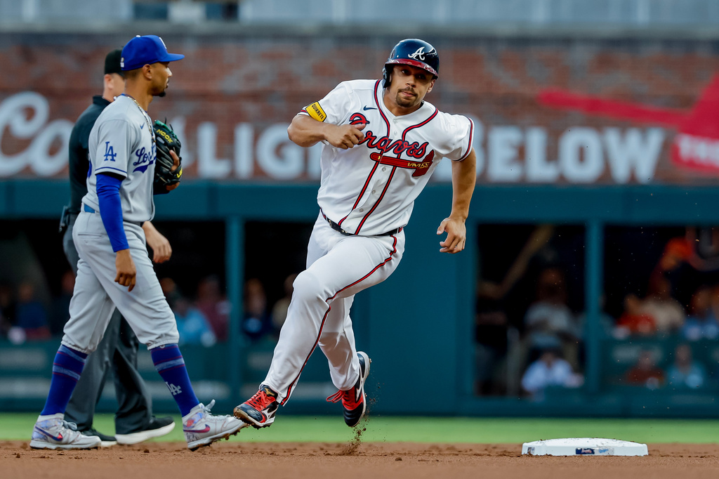 Atlanta Braves designated hitter Drake Baldwin advances from first to third base against the Los Angeles Dodgers during the first inning of a baseball game, Tuesday, August 25, 2026, in Atlanta. (AP Photo/Erik S. Lesser)