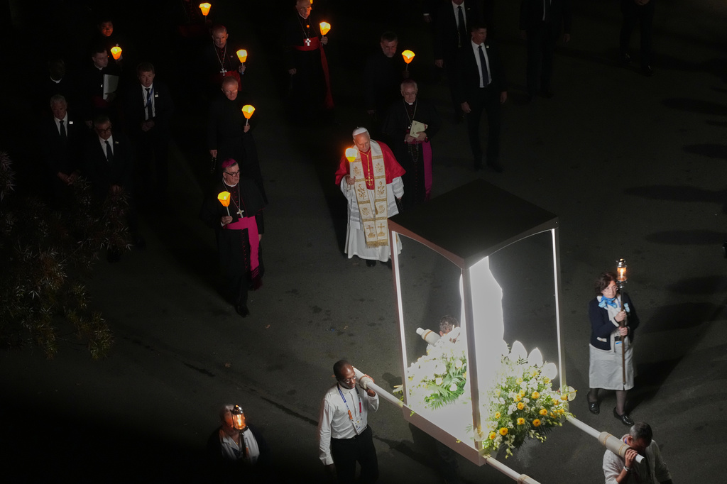 Pope Leo XIV arrives for a prayer of the Holy Rosary and a torchlight procession at the Shrine of Our Lady of Lourdes, Sunday, Sept. 27, 2026. (AP Photo/Gregorio Borgia)
