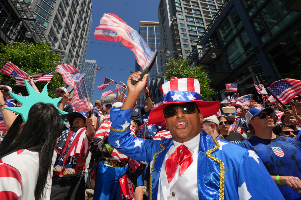 United States fan react during the march to the match before the World Cup round of 16 soccer match between the United States and Belgium in Seattle, Monday, July 6, 2026. (AP Photo/Eric Hiller)