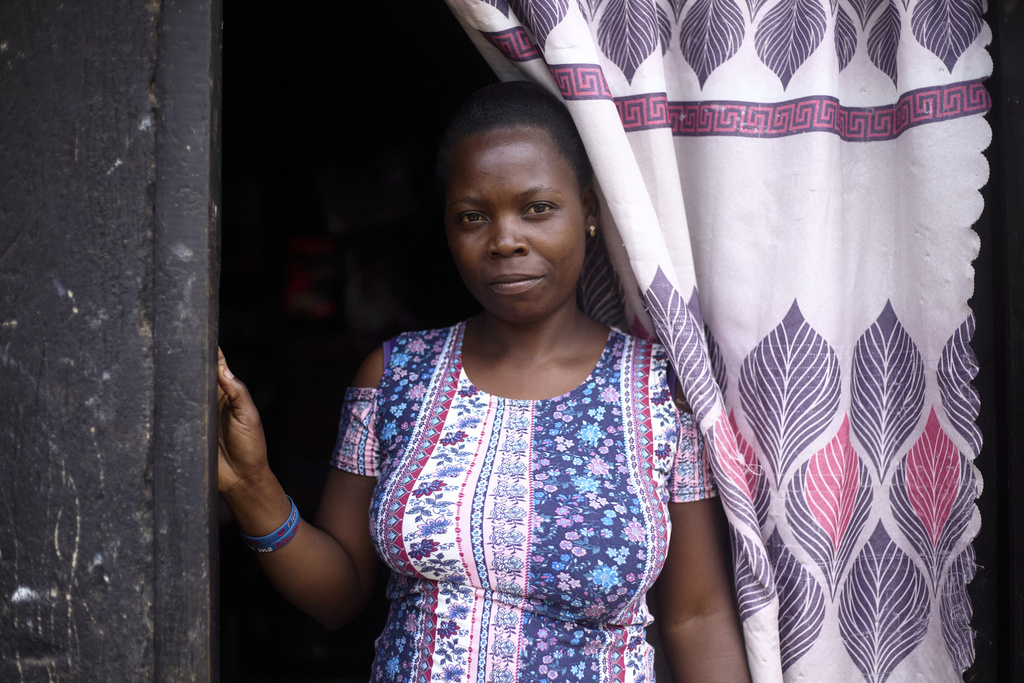 Alice Nekesa, 28, a mother of one who contracted malaria during her second pregnancy, poses for a photo in her home in Kampala, Uganda, Sunday, Aug. 17, 2025. (AP Photo/Patrick Onen)