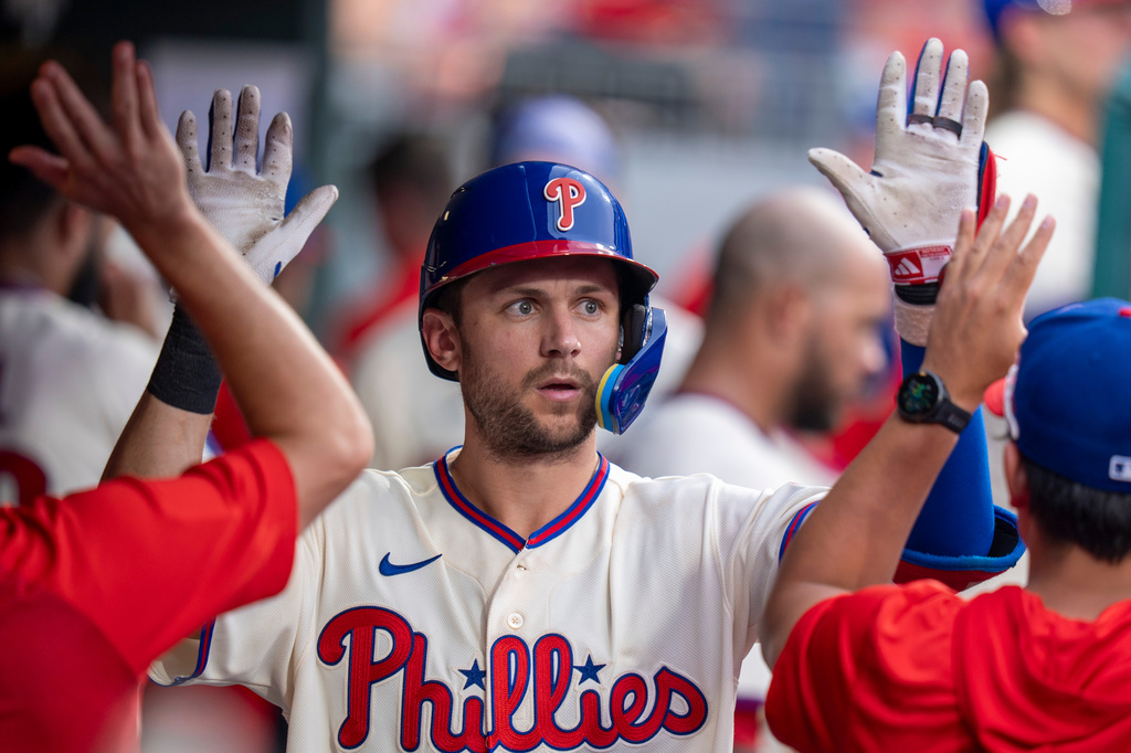 Philadelphia Phillies' Trea Turner celebrates his home run with teammates during the fifth inning of a baseball game against the New York Mets, Saturday, July 18, 2026, in Philadelphia. (AP Photo/Chris Szagola)