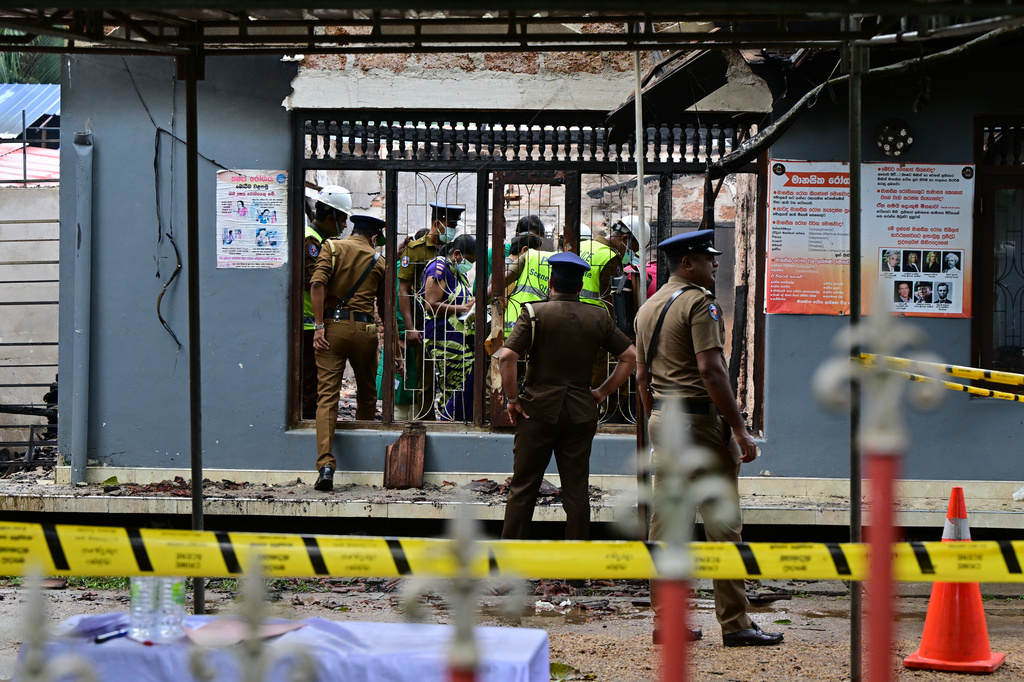 Sri Lankan police and judiciary officials inspect a charred elderly care home following an overnight fire in Anguruwatota, Sri Lanka, Thursday, June 4, 2026. (AP Photo)