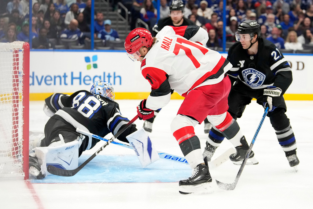 Tampa Bay Lightning goaltender Andrei Vasilevskiy (88) makes a save on a shot by Carolina Hurricanes left wing Taylor Hall (71) during the third period of an NHL hockey game Saturday, March 14, 2026, in Tampa, Fla. (AP Photo/Chris O'Meara)
