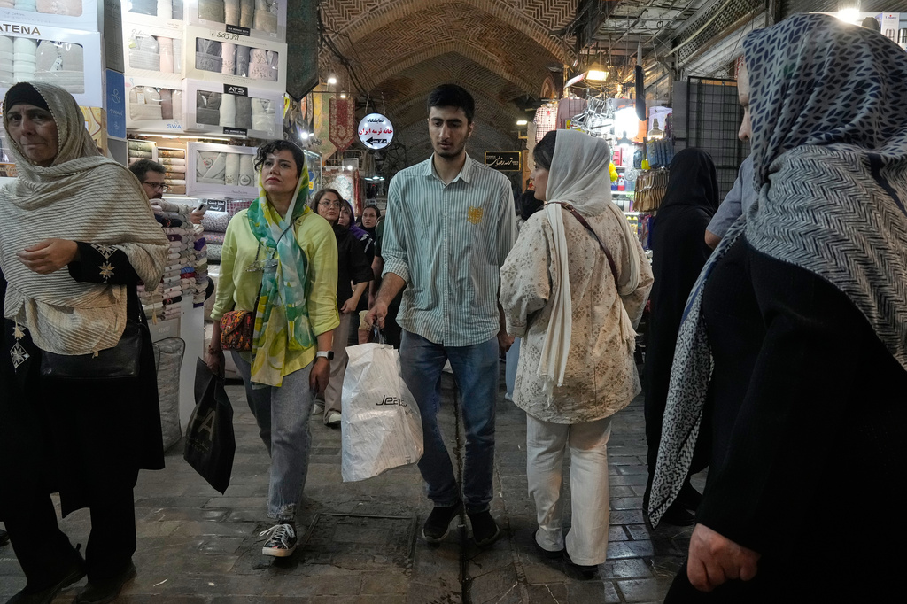 People walk at Tehran's historic Grand Bazaar, Iran, Monday, June 1, 2026. (AP Photo/Vahid Salemi)