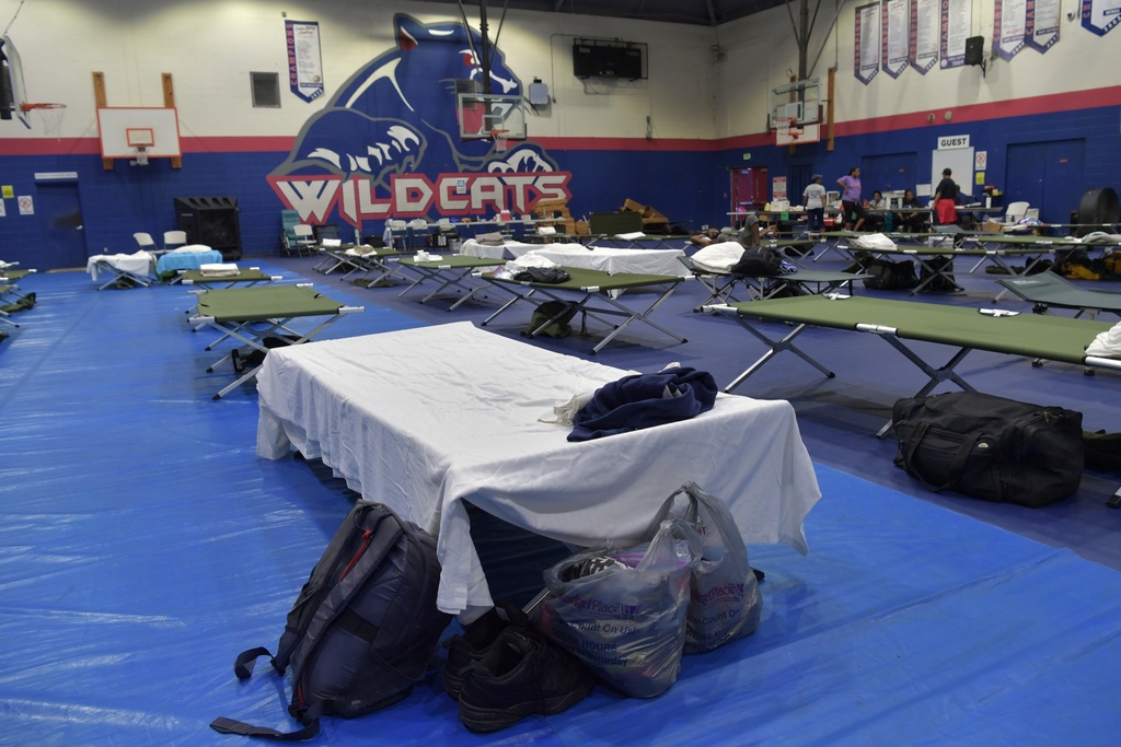 Beds and supplies sit at a sports center-turned-shelter ahead of Hurricane Imelda's expected arrival in Hamilton, Bermuda, Wednesday, Oct. 1, 2025. (AP Photo/Anthony Wade)