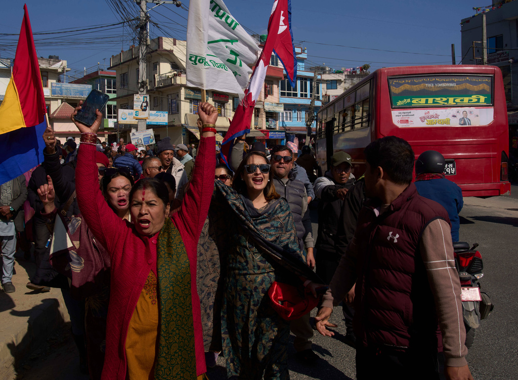 Supporter of Rastriya Prajatantra party gather to go to the election office to register their leader's candidacy for the general election to be held on March 5 in Kathmandu, Nepal, Tuesday, Jan. 20, 2026. (AP Photo/Niranjan Shrestha, File)