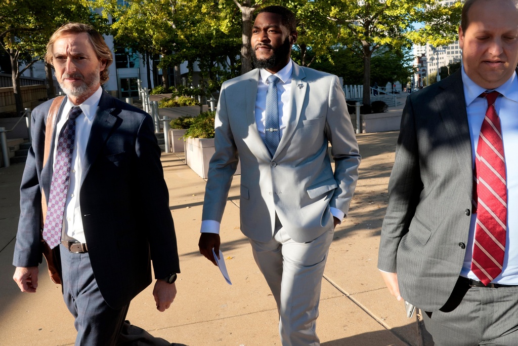 St. Louis Sheriff Alfred Montgomery, center, leaves the leaves the Thomas F. Eagleton U.S. Courthouse with his attorney's Bill Margulis, left, and Justin Gelfand, right, in St. Louis on Thursday, Oct. 9, 2025. (Laurie Skrivan/St. Louis Post-Dispatch via AP)