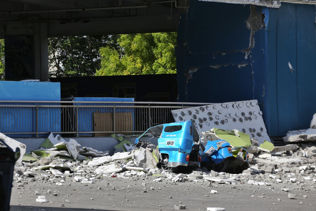 Debris lies on a road after an earthquake in General Santos, Philippines, Monday, June 8, 2026. (AP Photo)