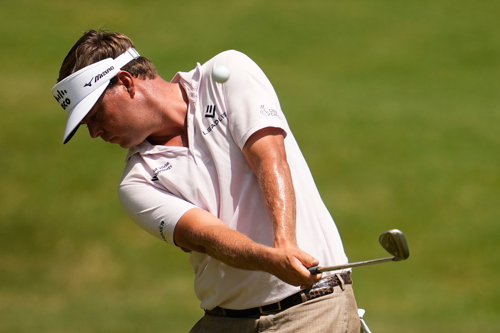 Keith Mitchell hits on the first hole during the third round of the St. Jude Championship golf tournament Saturday, Aug. 15, 2026, in Memphis, Tenn. (AP Photo/George Walker IV)