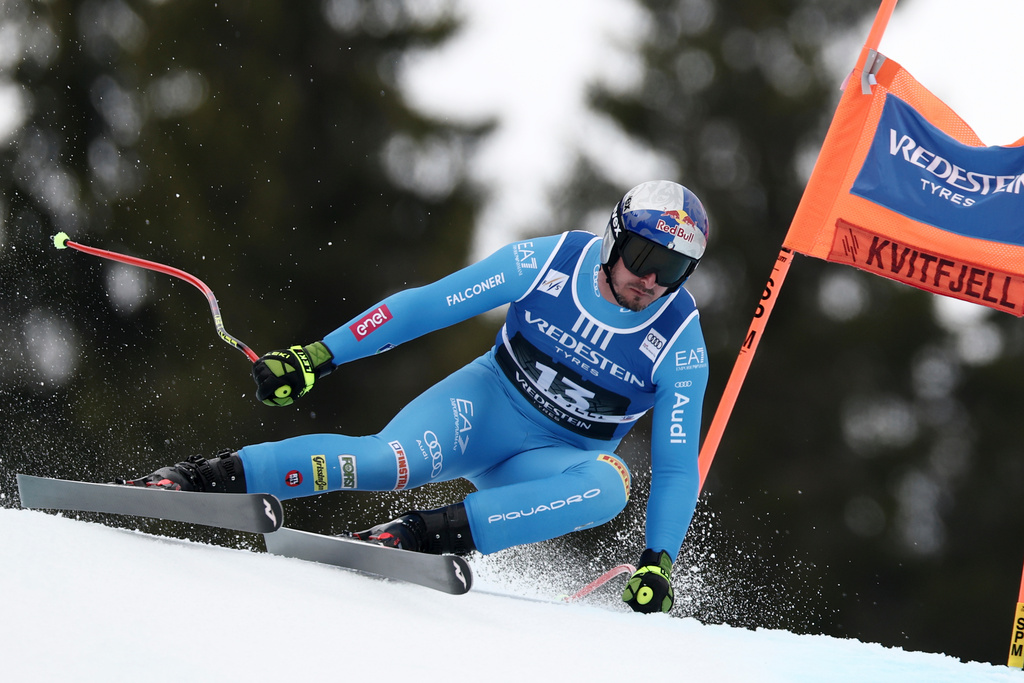 Italy's Dominik Paris speeds down the course during an alpine ski, men's super-G race, at the Lillehammer World Cup Finals, in Kvitfjell, Norway, Sunday, March 22, 2026. (AP Photo/Gabriele Facciotti)
