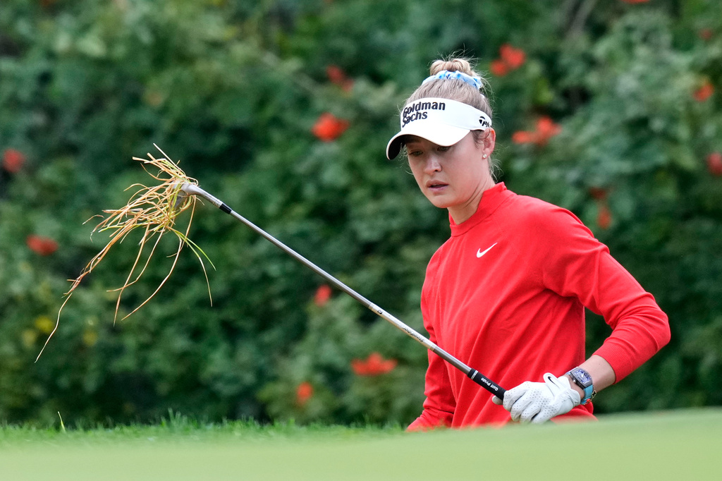 Grass hangs from the club of Nelly Korda on the 12th hole during the first round of the U.S. Women's Open golf tournament Thursday, June 4, 2026, in the Pacific Palisades area of Los Angeles. (AP Photo/Ashley Landis)