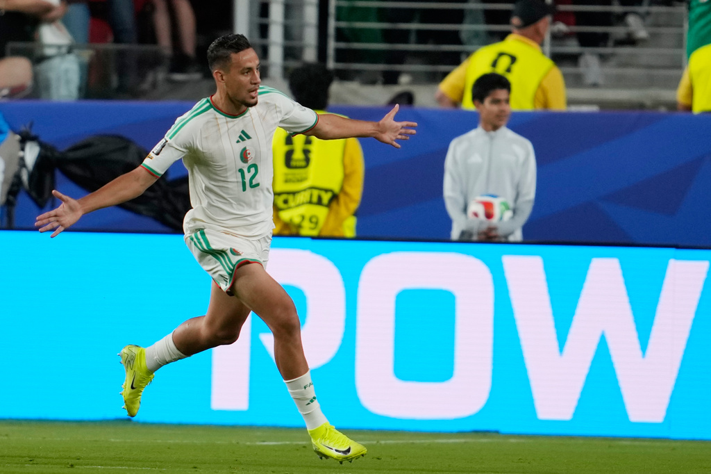 Algeria's Nadhir Benbouali (12) celebrates after scoring a goal during the World Cup Group J soccer match between Jordan and Algeria in Santa Clara, Calif., near San Francisco, Monday, June 22, 2026. (AP Photo/Eugene Hoshiko)