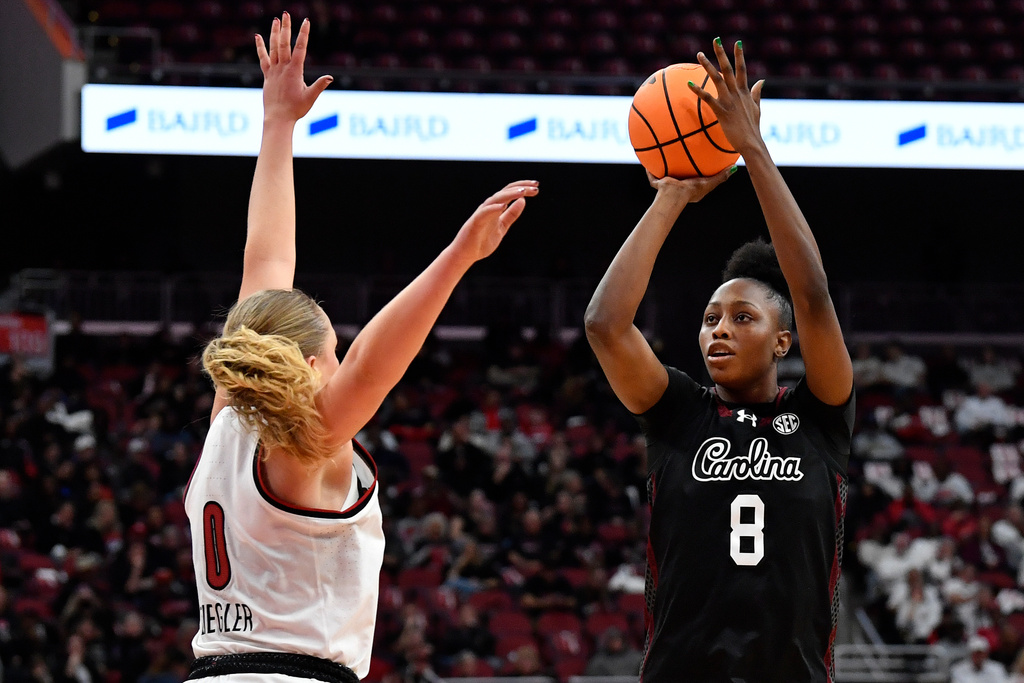 South Carolina forward Joyce Edwards (8) shoots over Louisville forward Laura Ziegler (0) during the second half of an NCAA college basketball game in Louisville, Ky., Thursday, Dec. 4, 2025. (AP Photo/Timothy D. Easley)