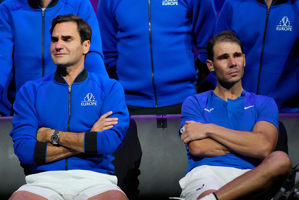 FILE - An emotional Roger Federer, left, of Team Europe sits alongside his playing partner Rafael Nadal after their Laver Cup doubles match against Team World's Jack Sock and Frances Tiafoe at the O2 arena in London, Sept. 23, 2022. (AP Photo/Kin Cheung, file)