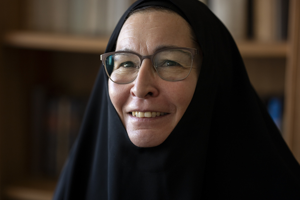Sister Vassa Larin, a prominent American Orthodox nun, public speaker and YouTube presenter, smiles while recording one of her videos in Vienna, Austria, on Wednesday, Sept 3. 2025. (AP Photo/Denes Erdos)