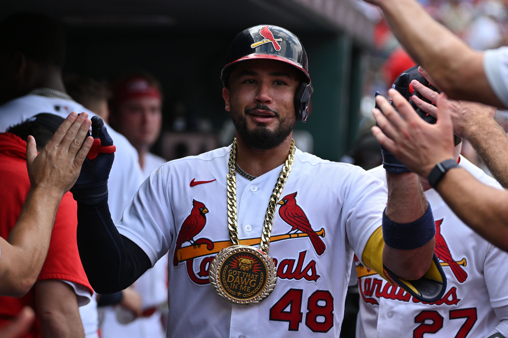 St. Louis Cardinals' Iván Herrera is congratulated by teammates after hitting a home run against the Cincinnati Reds during the third inning of a baseball game, Sunday, July 26, 2026, in St. Louis. (AP Photo/Jeff Le)