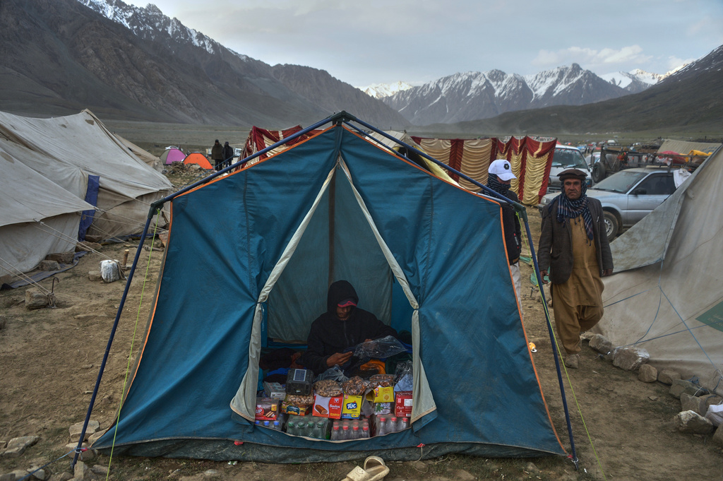 A vendor waits for customers in his snack stall during the three-day annual Shandur Polo Festival in Shandur Pass in the Ghizer district of Gilgit-Baltistan, northern Pakistan, Friday, June 12, 2026. (AP Photo/Zubair Abbasi)