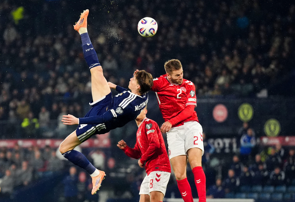 Scotland's Scott McTominay scores the opening goal during the 2026 World Cup European Qualifying soccer match between Scotland and Denmark at Hampden Park, Glasgow, Scotland, Tuesday, Nov. 18, 2025. (Andrew Milligan/PA via AP)