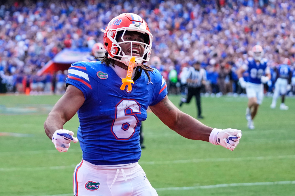 Florida wide receiver Dallas Wilson (6) celebrates after scoring a touchdown against Texas on a 55-yard pass play during the second half of an NCAA college football game, Saturday, Oct. 4, 2025, in Gainesville, Fla. (AP Photo/John Raoux)