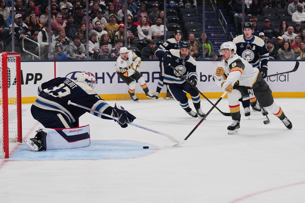 Vegas Golden Knights center Jack Eichel (9) attempts a shot as Columbus Blue Jackets goaltender Cam Talbot (33) defends during the first period of an NHL hockey game Saturday, Oct. 24, 2026, in Columbus, Ohio. (AP Photo/Joshua A. Bickel)