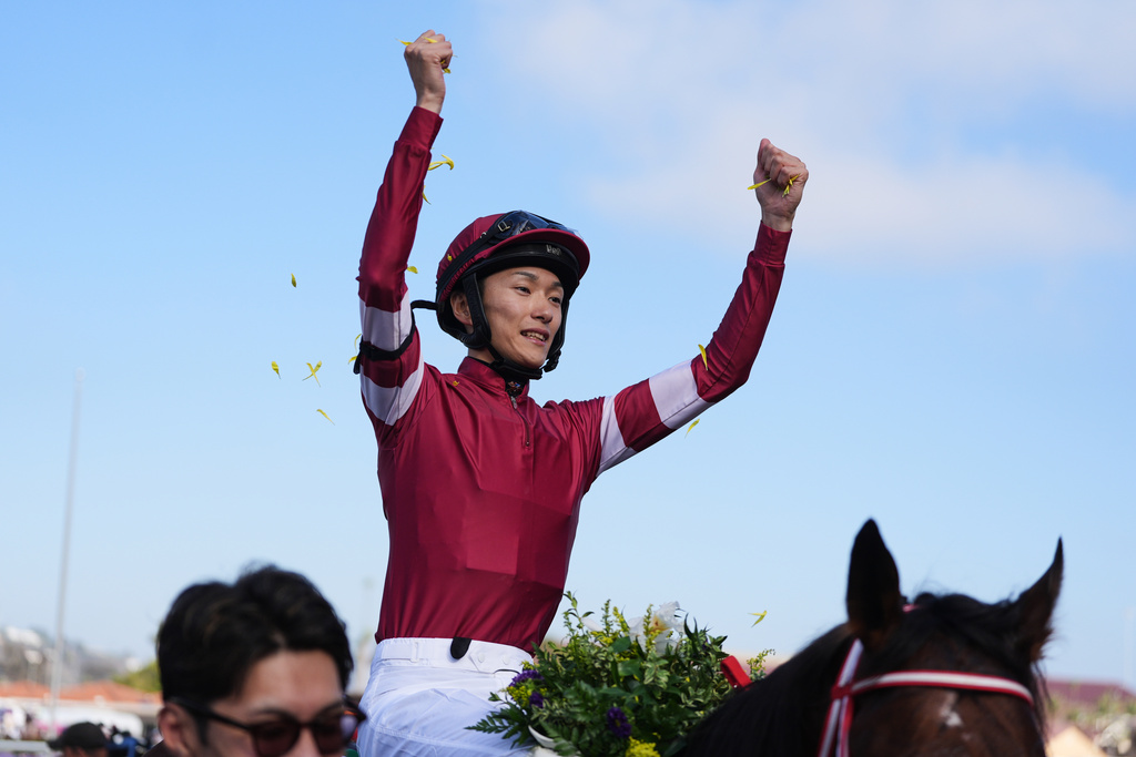 Ryusei Sakai celebrates after riding Forever Young to victory in the Breeders' Cup Classic horse race on Saturday, Nov. 1, 2025, in Del Mar, Calif. (AP Photo/Gregory Bull)