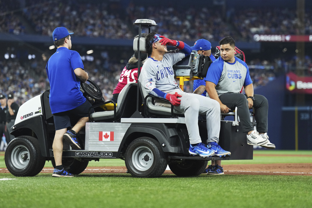Chicago Cubs catcher Miguel Amaya (9) leaves the game with an injury during eighth inning MLB baseball action against the Toronto Blue Jays in Toronto on Wednesday, August 13, 2025. (Nathan Denette/The Canadian Press via AP)