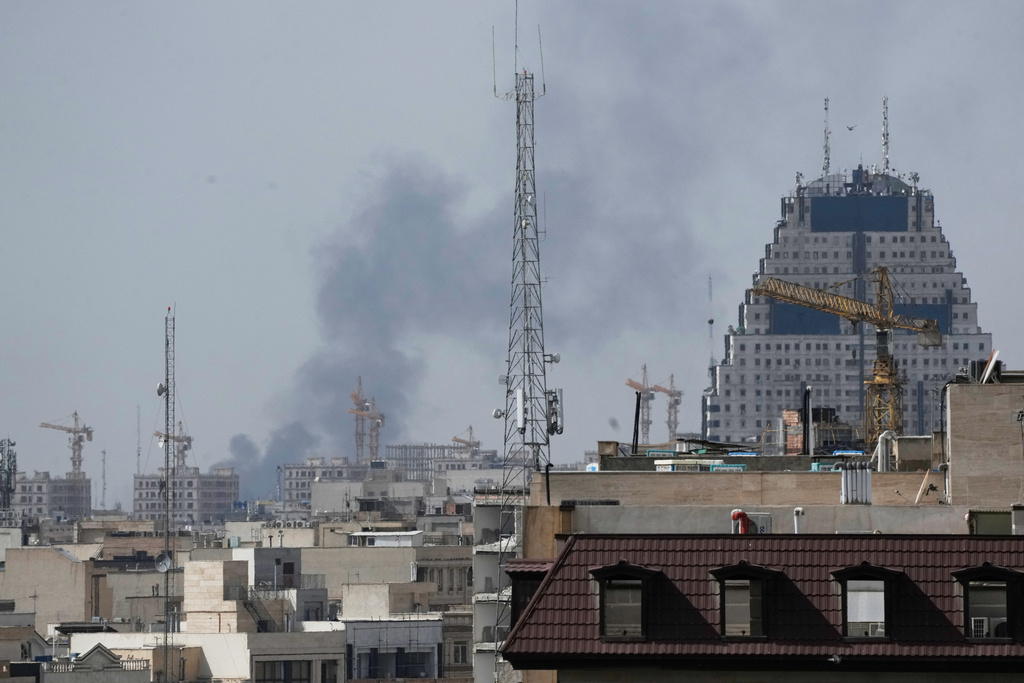 Smoke rises on the skyline after an explosion in Tehran, Iran, Saturday, Feb. 28, 2026.(AP Photo/Vahid Salemi)