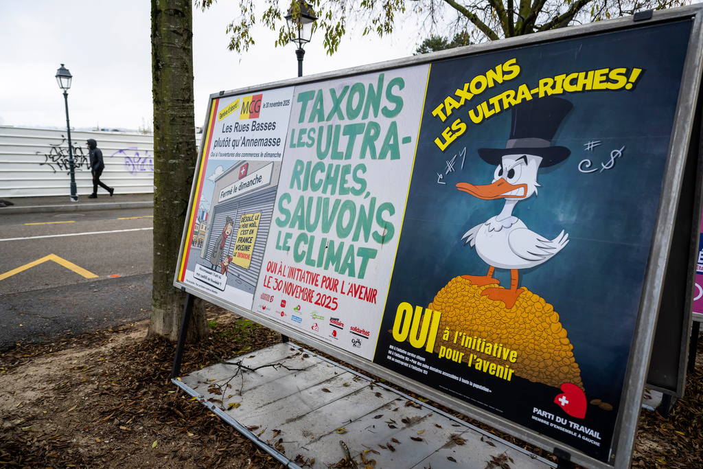 A person walks by referendum posters of political parties and associations as Swiss voters are casting ballots to decide whether women, like men, must do national service in the military, civil protection teams or in other forms, in Geneva, Switzerland, on Nov. 26, 2025. (Martial Trezzini/Keystone via AP)