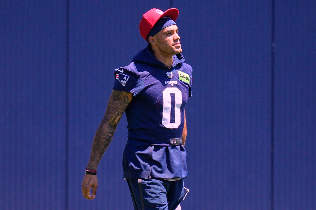New England Patriot's Christian Gonzalez arrives for an NFL football practice, Tuesday, June 9, 2026, in Foxborough, Mass. (AP Photo/Charles Krupa)