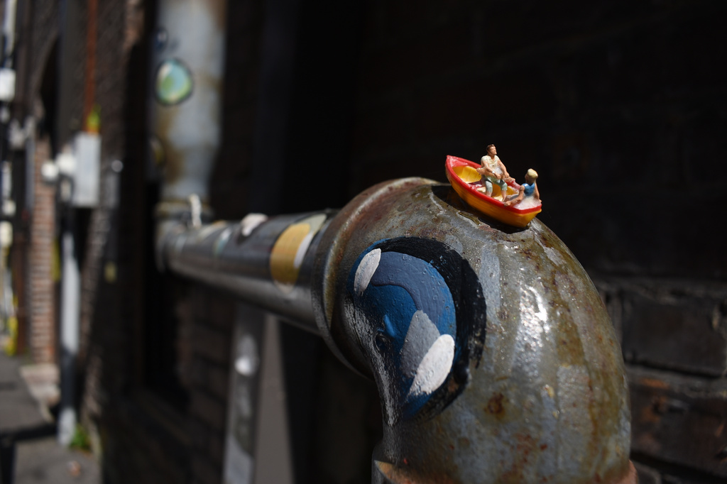 Two figurines canoe down a painted pipe at the Hattiesburg Pocket Museum, in Hattiesburg, Miss., on Wednesday, March 25, 2026. (AP Photo/Sophie Bates)