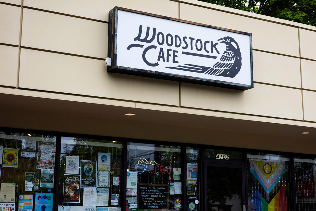A sign for Woodstock Cafe is seen on May 15, 2025, in Portland, Ore. (Allison Barr/The Oregonian via AP)