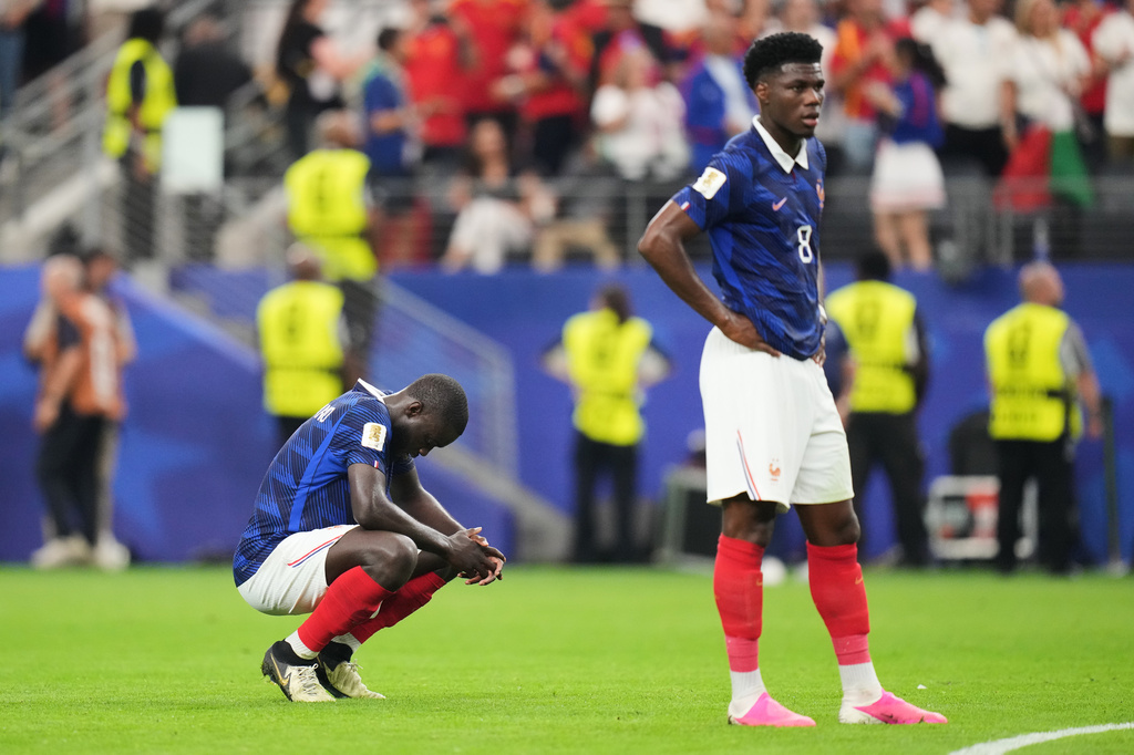 France's Dayot Upamecano, left, and Aurelien Tchouameni (8) stand dejected after the World Cup semifinal soccer match between France and Spain in Arlington, Texas, near Dallas, Tuesday, July 14, 2026.(AP Photo/Eric Gay)
