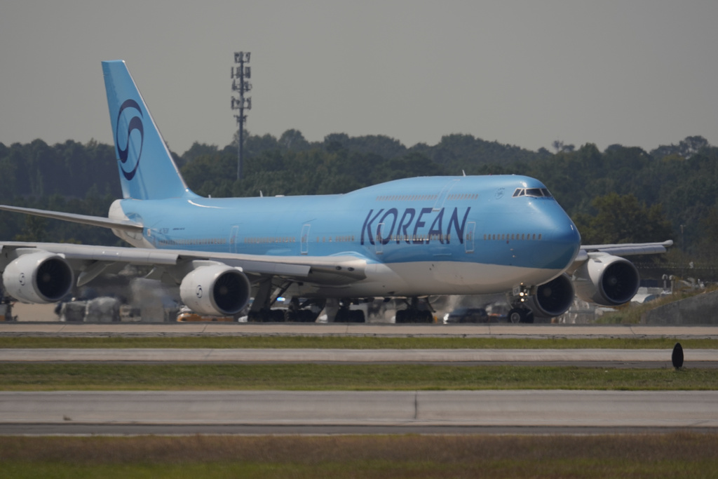 A plane prepares to take off with Korean workers that were detained at Hartsfield-Jackson International Airport in Atlanta, Thursday, Sept. 11, 2025. (AP Photo/George Walker IV)