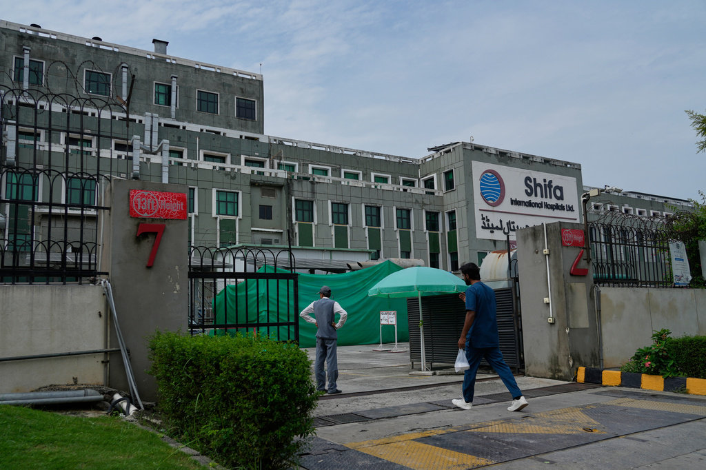 A medical person enters Shifa International Hospital, where imprisoned former Prime Minister Imran Khan will be transferred for a medical examination following Pakistan's Supreme Court order, in Islamabad, Pakistan, Tuesday, Aug. 18, 2026. (AP Photo/Anjum Naveed)