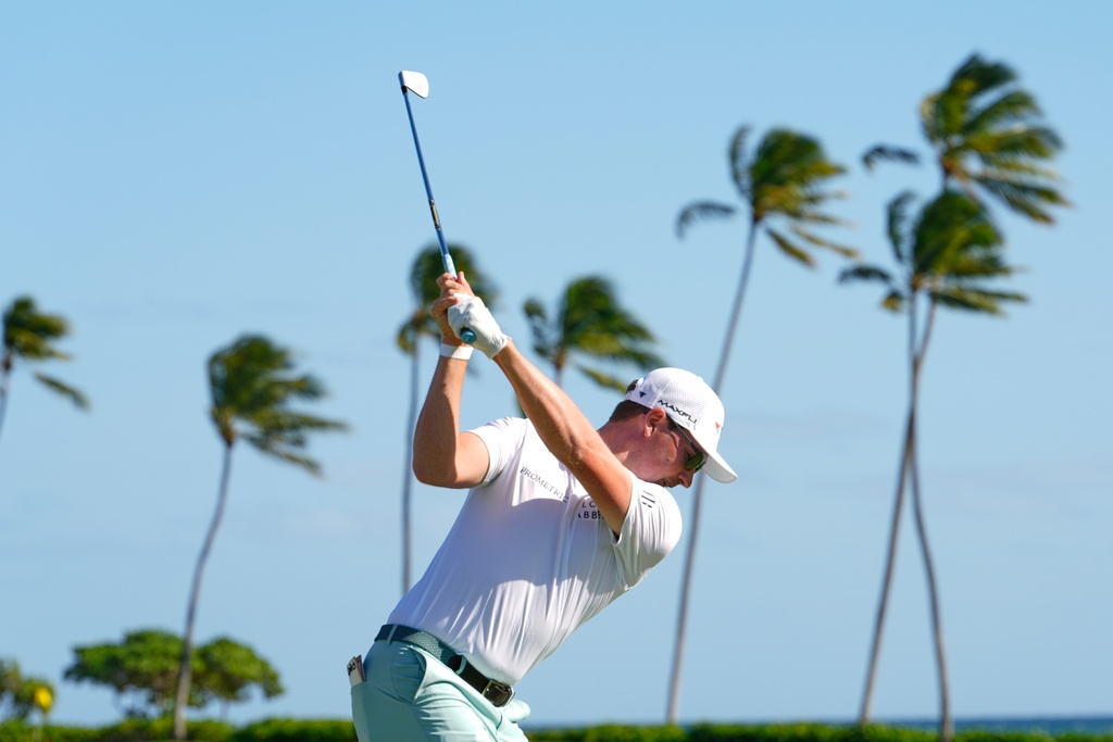 Ben Griffin hits on the 11th hole during the second round of the Sony Open golf event at the Waialae Country Club in Honolulu, Friday, Jan. 16, 2026. (AP Photo/Matt York)